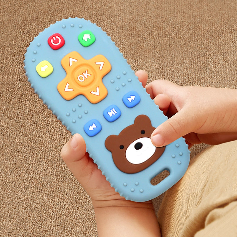 Blue silicone baby remote teether held by a child