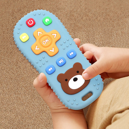 Blue silicone baby remote teether held by a child