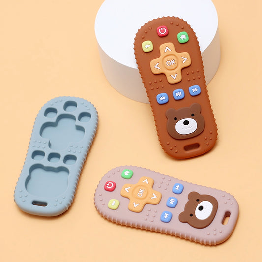 Silicone baby remote teether in blue, light pink, and brown